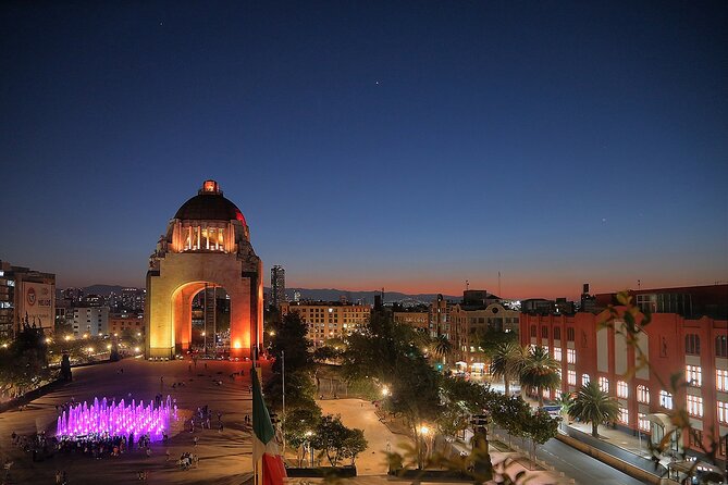 Night Tour of Mexico City Panoramic Ride on a Double-Decker Bus - The Angel of Independence lit at night