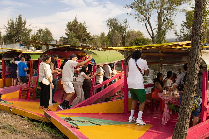 Xochimilco BOAT LIGHT PARTY WITH 1 DRINK AND 4 TAQUITOES + 18 - A floating party, not a sightseeing cruise