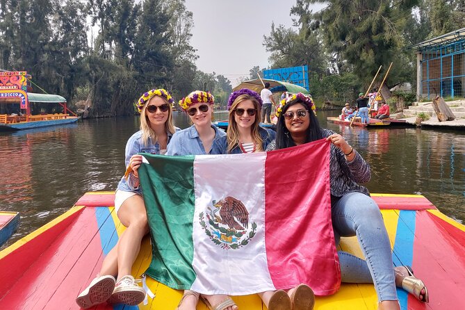Xochimilco & Mexican Party with Guacamole & Unlimited Drinks - Making guacamole with your boatmates
